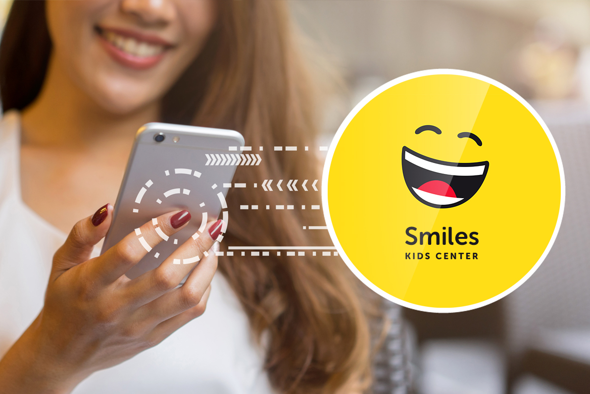 Lady smiling at her phone